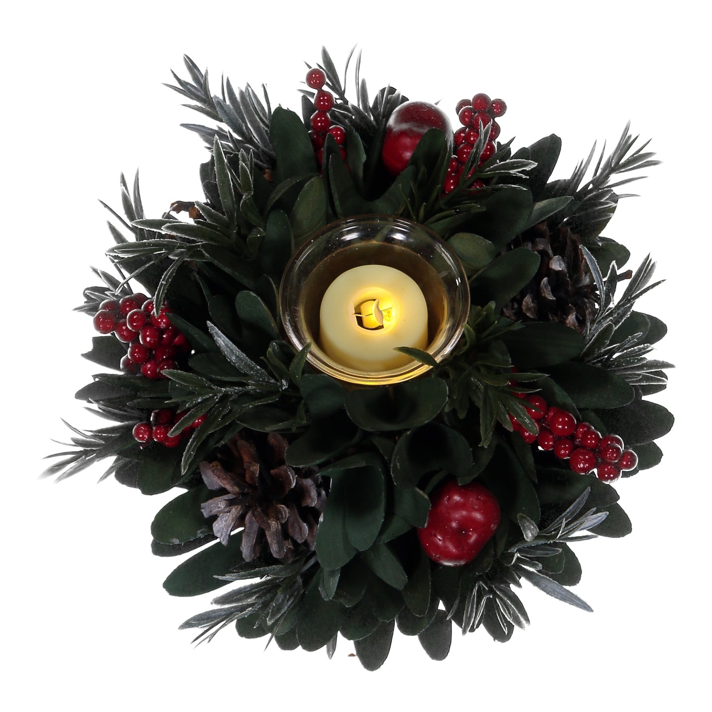 Decorative wreath with a candle surrounded by greenery and red berries on a white background
