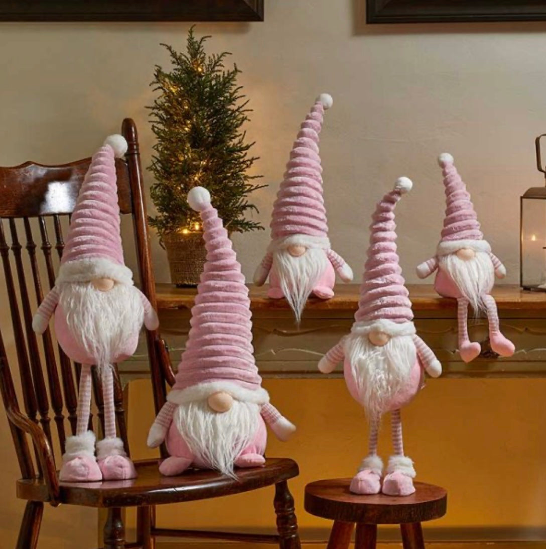 “Freestanding pink Christmas gonk with tall ribbed hat, long white beard, striped arms, and plush boots – Nordic-style holiday decoration.”