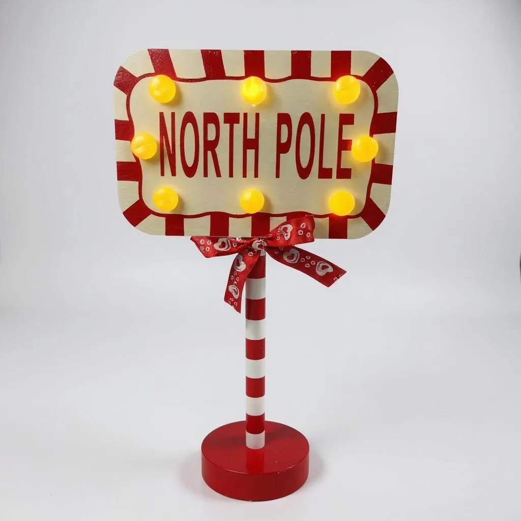 Decorative sign with 'North Pole' text on a white background