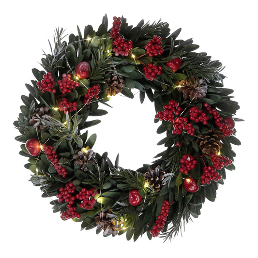 Decorative wreath with red berries and lights on a white background