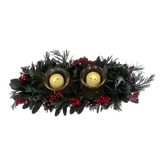 Decorative wreath with candles and berries on a white background