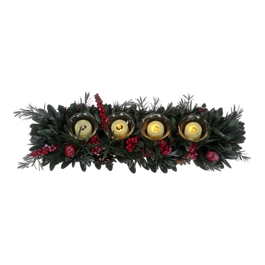 Decorative wreath with candles and greenery on a white background