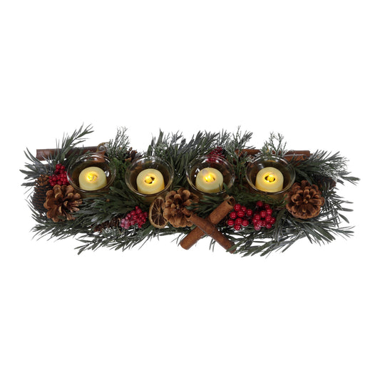 Decorative wreath with candles, pine cones, and cinnamon sticks on a white background