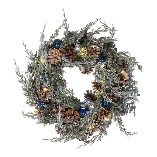 Decorative wreath with pinecones and lights on a white background