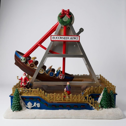 Decorative model of a pirate ship with Santa Claus and other figures on a white background